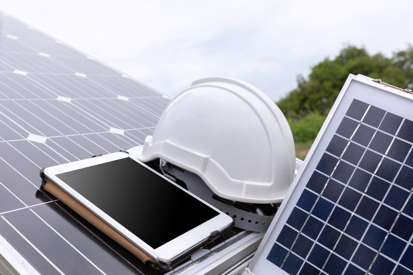 engineer solar photovoltaic panels station checks with tablet co
